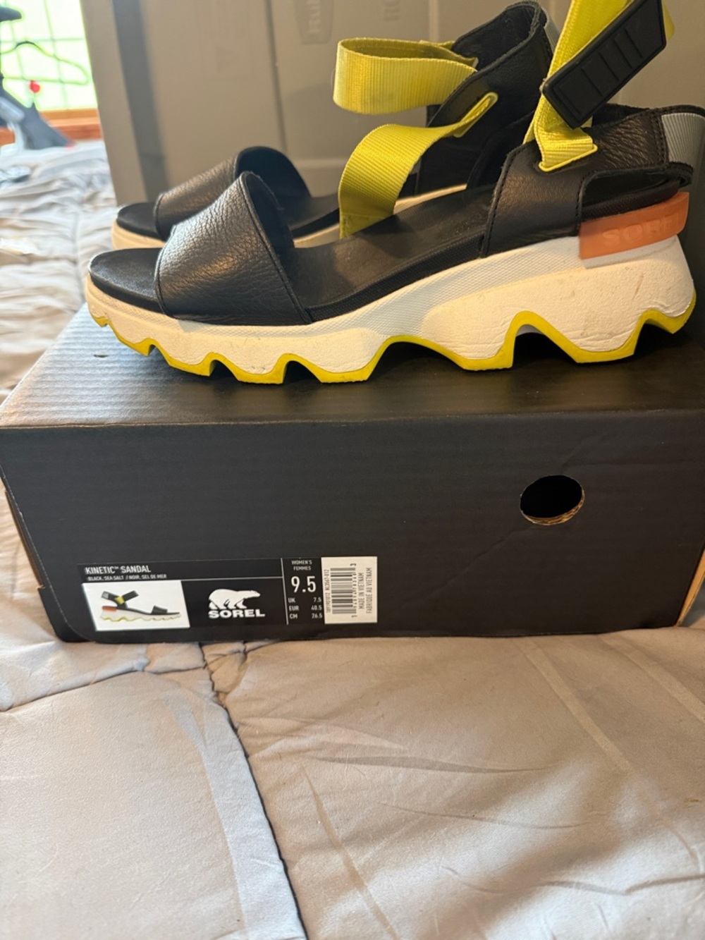Sorel Black and Yellow Kinetic Platform Sandals